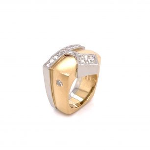 White gold diamond with a touch of yellow gold. The ring features square bezel and baguette diamonds and variety of small diamonds, in an upright position.